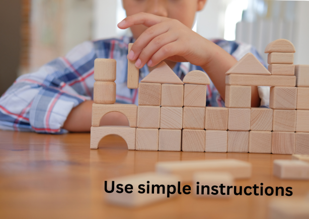 A child building with wooden blocks, captioned 'Use simple instructions'